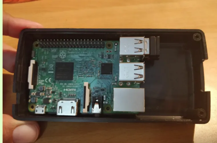 Raspberry Pi fitted inside a laptop-charger case